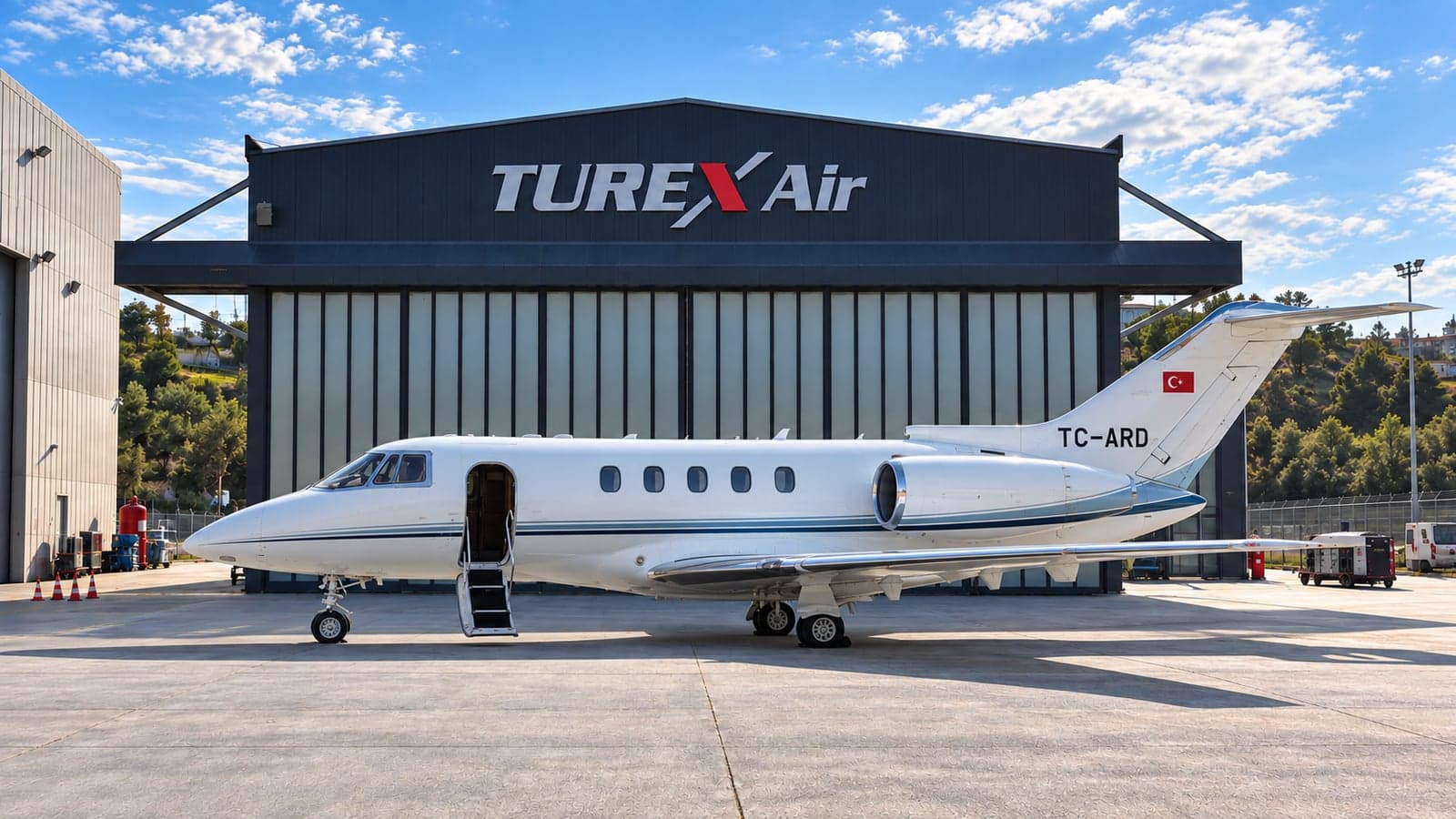 Exterior view of the Hawker 800XP registered TC-ARD parked in front of the Turex Air hangar