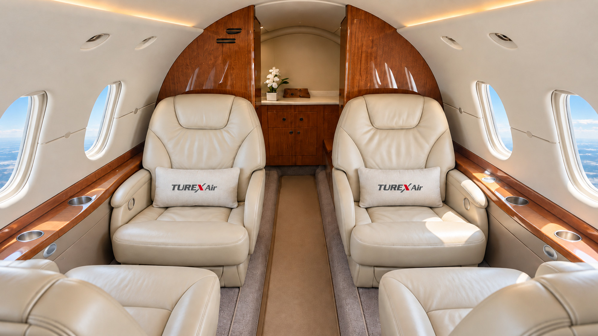 Two facing leather club seats with Turex Air cushions and the walnut-veneered galley behind them in the Hawker 800XP cabin